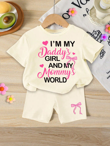 Front view of baby girl 2-piece tie-dye summer outfit set with smiley face tee and shorts