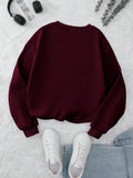 INAWLY burgundy long sleeve pullover sweatshirt laid flat with casual jeans